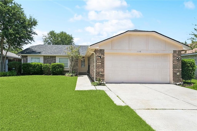 128 Hollow Rock Ct, Slidell, LA 70461 - ranch-style home featuring concrete driveway, an attached garage, brick siding, and a front lawn