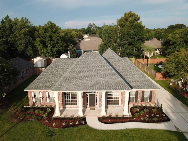 319 Red Maple Dr, Mandeville, LA 70448 - view of front of property featuring brick siding and roof with shingles