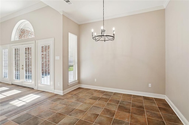 319 Red Maple Dr, Mandeville, LA 70448 - unfurnished dining area featuring dark tile patterned floors, a chandelier, and crown molding