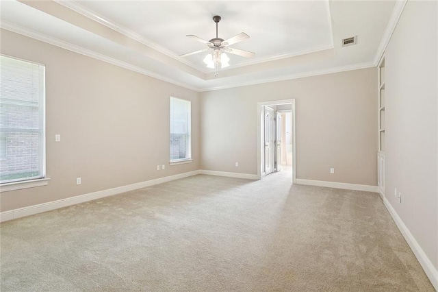 319 Red Maple Dr, Mandeville, LA 70448 - unfurnished room featuring a raised ceiling, light carpet, crown molding, and a ceiling fan