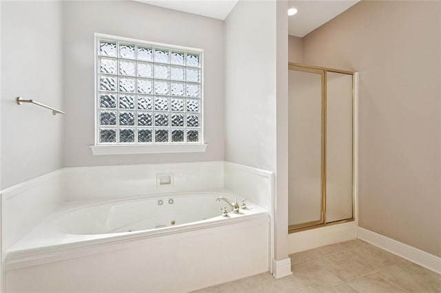 319 Red Maple Dr, Mandeville, LA 70448 - full bathroom with a jetted tub, a stall shower, and tile patterned flooring