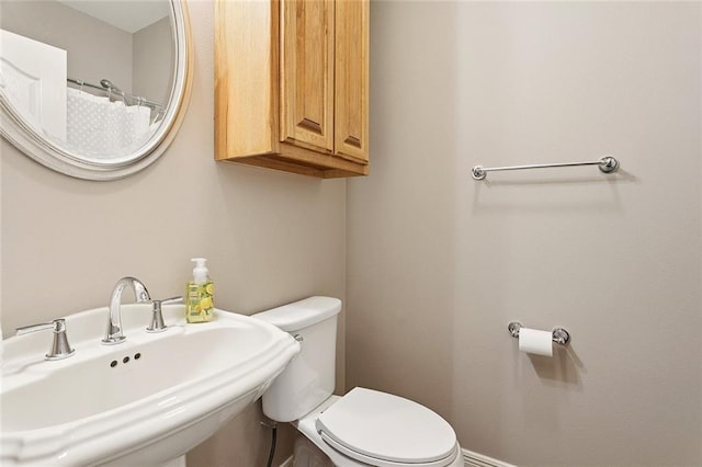 319 Red Maple Dr, Mandeville, LA 70448 - bathroom featuring a sink and a shower with shower curtain