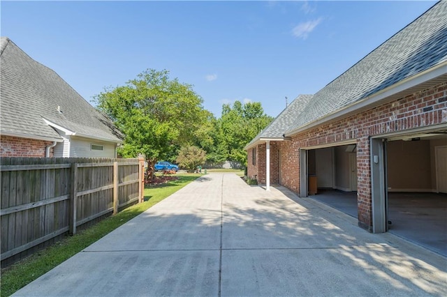 319 Red Maple Dr, Mandeville, LA 70448 - view of patio / terrace with driveway and a garage