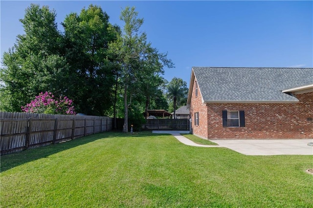 319 Red Maple Dr, Mandeville, LA 70448 - fenced backyard featuring a patio area