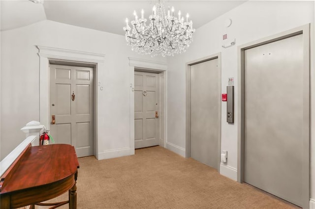 5421 St Charles Ave Unit 2D, New Orleans, LA 70115 - hallway with elevator, light colored carpet, and a chandelier