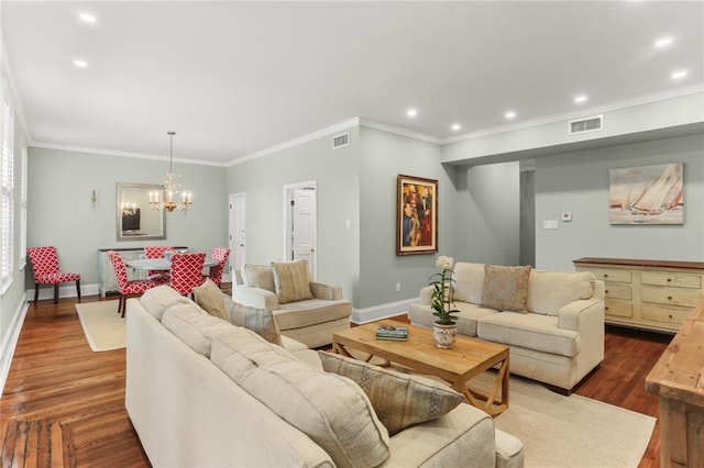 5421 St Charles Ave Unit 2D, New Orleans, LA 70115 - living room featuring a chandelier, crown molding, recessed lighting, and dark wood-type flooring