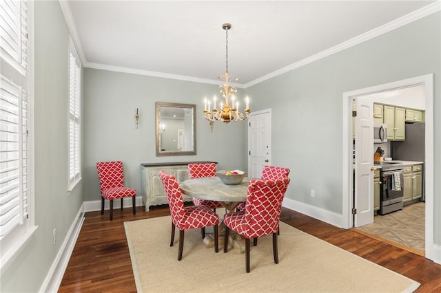 5421 St Charles Ave Unit 2D, New Orleans, LA 70115 - dining area with ornamental molding, dark wood-style floors, and a chandelier