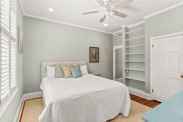 5421 St Charles Ave Unit 2D, New Orleans, LA 70115 - bedroom with crown molding, recessed lighting, wood finished floors, and a ceiling fan