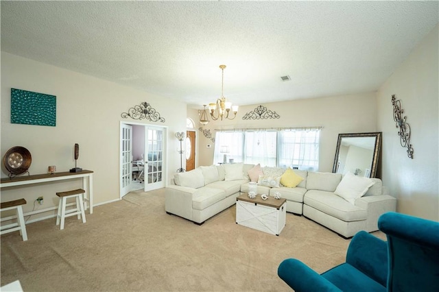 157 Barnes Ct, Gretna, LA 70056 - carpeted living area with a chandelier, french doors, and a textured ceiling