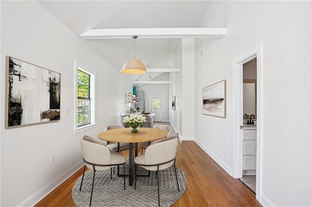 1431 Port St, New Orleans, LA 70117 - dining space with wood finished floors, beam ceiling, and high vaulted ceiling