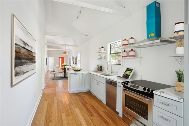 1431 Port St, New Orleans, LA 70117 - kitchen featuring island exhaust hood, stainless steel appliances, open shelves, light wood-type flooring, and rail lighting
