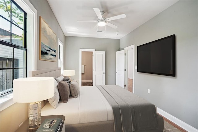 1431 Port St, New Orleans, LA 70117 - bedroom featuring a ceiling fan and ensuite bathroom