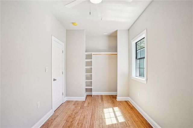 1431 Port St, New Orleans, LA 70117 - unfurnished bedroom with wood finished floors, a closet, and a ceiling fan