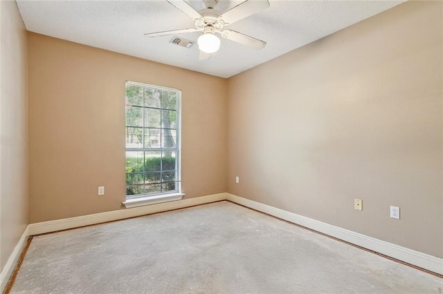 3 Trace Loop, Mandeville, LA 70448 - unfurnished room with plenty of natural light, a ceiling fan, a textured ceiling, and concrete floors