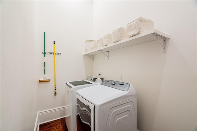 2546 Onzaga St, New Orleans, LA 70119 - laundry room featuring washer and clothes dryer and wood finished floors