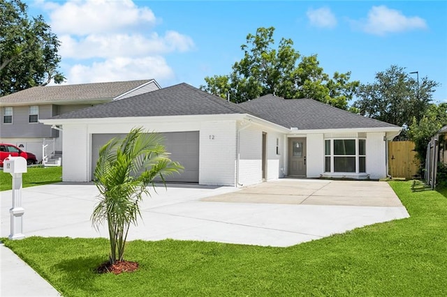 12 Fairlane Dr, Metairie, LA 70003 - ranch-style home featuring concrete driveway, an attached garage, a shingled roof, and brick siding