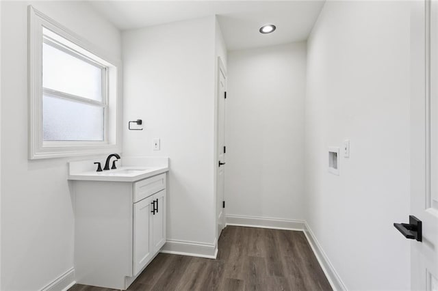 12 Fairlane Dr, Metairie, LA 70003 - bathroom with wood finished floors, vanity, and recessed lighting