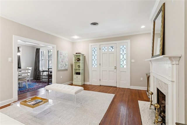 1338 Fern St, New Orleans, LA 70118 - entryway with hardwood / wood-style floors, ornamental molding, a high end fireplace, and recessed lighting
