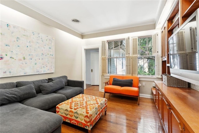1338 Fern St, New Orleans, LA 70118 - living room with light wood-style flooring and crown molding