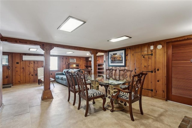 1338 Fern St, New Orleans, LA 70118 - dining area with wooden walls and a wall unit AC