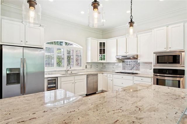 217 Sap Berry Dr, Madisonville, LA 70447 - kitchen featuring stainless steel appliances, beverage cooler, under cabinet range hood, white cabinetry, and light stone countertops