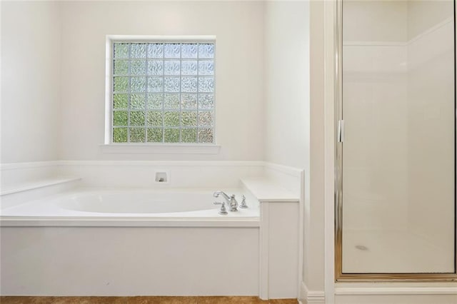 217 Sap Berry Dr, Madisonville, LA 70447 - bathroom featuring a stall shower and a garden tub