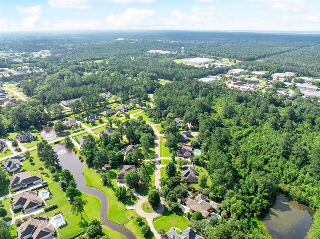 217 Sap Berry Dr, Madisonville, LA 70447 - aerial perspective of suburban area with a large body of water