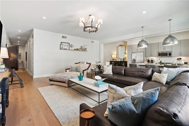 731 St Charles Ave Unit 310, New Orleans, LA 70130 - living area with a chandelier, light wood finished floors, and recessed lighting