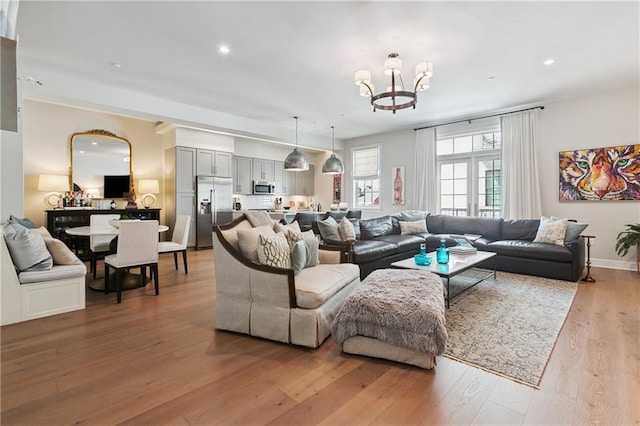 731 St Charles Ave Unit 310, New Orleans, LA 70130 - living room with a chandelier, light wood-style floors, and recessed lighting