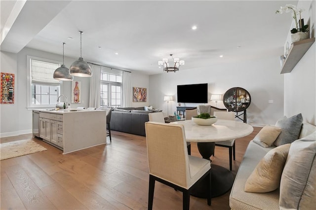 731 St Charles Ave Unit 310, New Orleans, LA 70130 - dining space with light wood-style floors, recessed lighting, and a chandelier