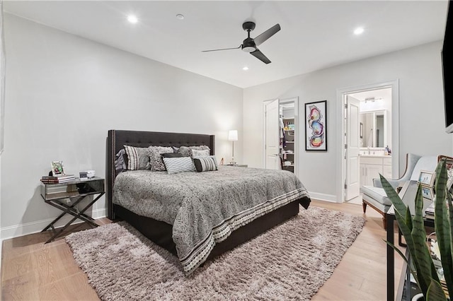 731 St Charles Ave Unit 310, New Orleans, LA 70130 - bedroom featuring light wood finished floors, ensuite bathroom, recessed lighting, a walk in closet, and ceiling fan