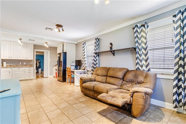 82 Packenham Ave, Chalmette, LA 70043 - living room with light tile patterned floors and crown molding