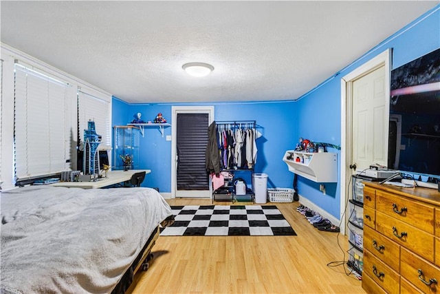 82 Packenham Ave, Chalmette, LA 70043 - bedroom featuring wood finished floors and a textured ceiling