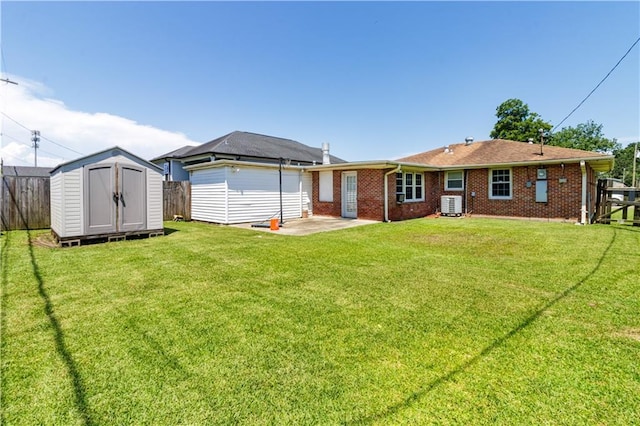 82 Packenham Ave, Chalmette, LA 70043 - back of property with a shed, a patio area, and brick siding