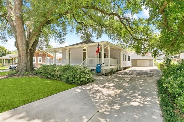 202 Amelia St, Destrehan, LA 70047 - view of front of house featuring covered porch, a front lawn, and a garage