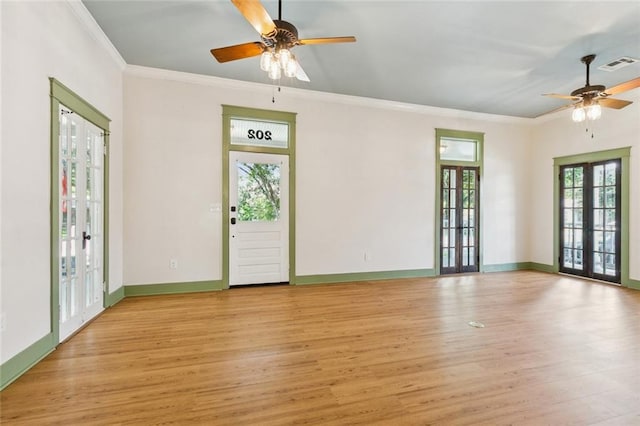 202 Amelia St, Destrehan, LA 70047 - unfurnished living room with french doors, a ceiling fan, light wood-style flooring, and ornamental molding