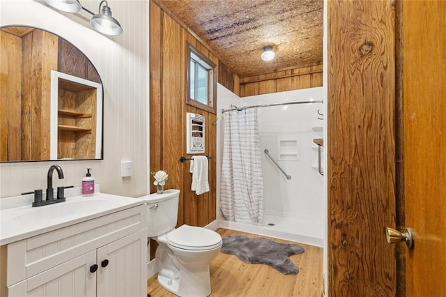 202 Amelia St, Destrehan, LA 70047 - full bathroom with vanity, a shower with shower curtain, and wood finished floors