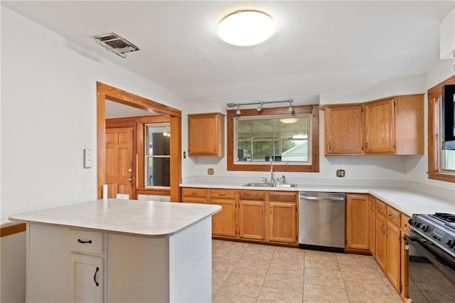805 Ave A, Marrero, LA 70072 - kitchen featuring dishwasher, black range, light countertops, and rail lighting