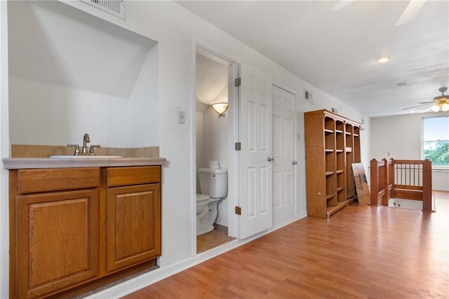 805 Ave A, Marrero, LA 70072 - bathroom featuring a ceiling fan, wood finished floors, vanity, and recessed lighting