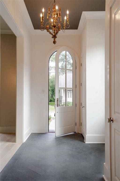 209 Avenue E Ave E, Metairie, LA 70005 - foyer with a chandelier and baseboards