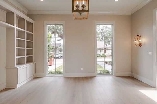 209 Avenue E Ave E, Metairie, LA 70005 - unfurnished dining area with a chandelier, light wood finished floors, ornamental molding, and recessed lighting