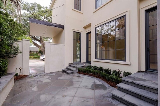 209 Avenue E Ave E, Metairie, LA 70005 - property entrance with stucco siding and a patio area