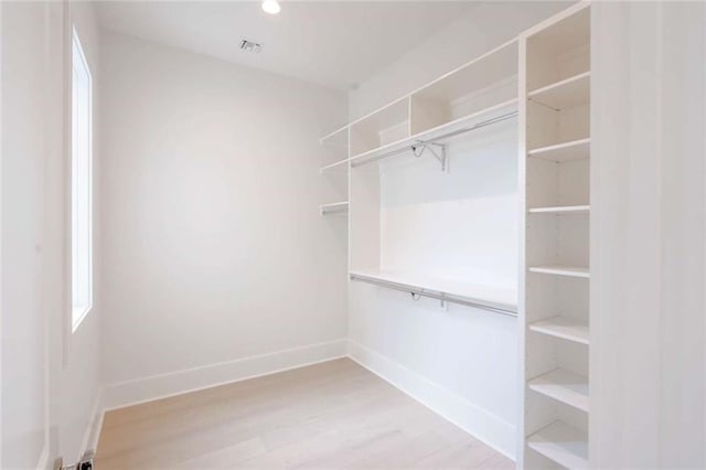 209 Avenue E Ave E, Metairie, LA 70005 - spacious closet with light wood-style floors
