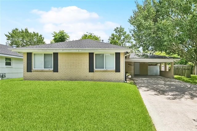 2900 Somerset Dr, New Orleans, LA 70131 - view of front of property with brick siding, concrete driveway, an attached carport, and a shingled roof