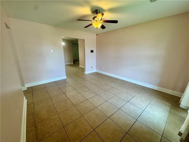 3509 Decomine Dr, Chalmette, LA 70043 - tiled spare room with ceiling fan and baseboards