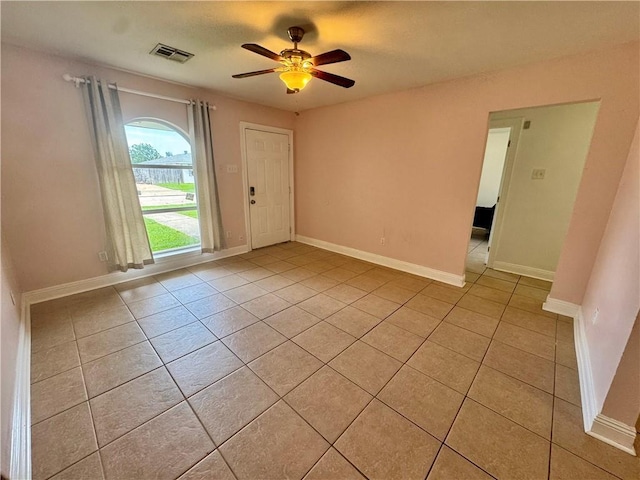 3509 Decomine Dr, Chalmette, LA 70043 - foyer entrance with light tile patterned floors and ceiling fan