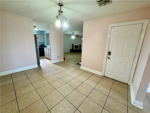 3509 Decomine Dr, Chalmette, LA 70043 - spare room featuring ceiling fan and light tile patterned floors