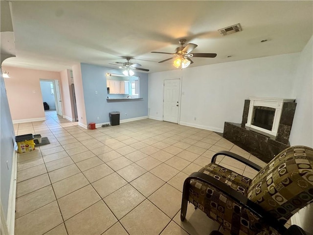 3509 Decomine Dr, Chalmette, LA 70043 - living area featuring light tile patterned flooring, ceiling fan, and a fireplace