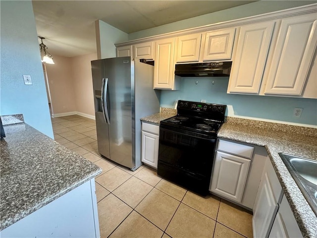 3509 Decomine Dr, Chalmette, LA 70043 - kitchen with black electric range oven, exhaust hood, stainless steel refrigerator with ice dispenser, light tile patterned flooring, and dark stone countertops