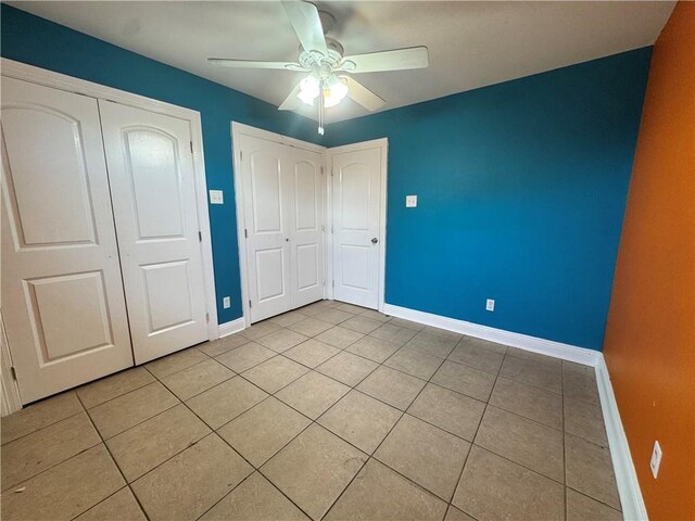 3509 Decomine Dr, Chalmette, LA 70043 - unfurnished bedroom featuring light tile patterned floors and a ceiling fan